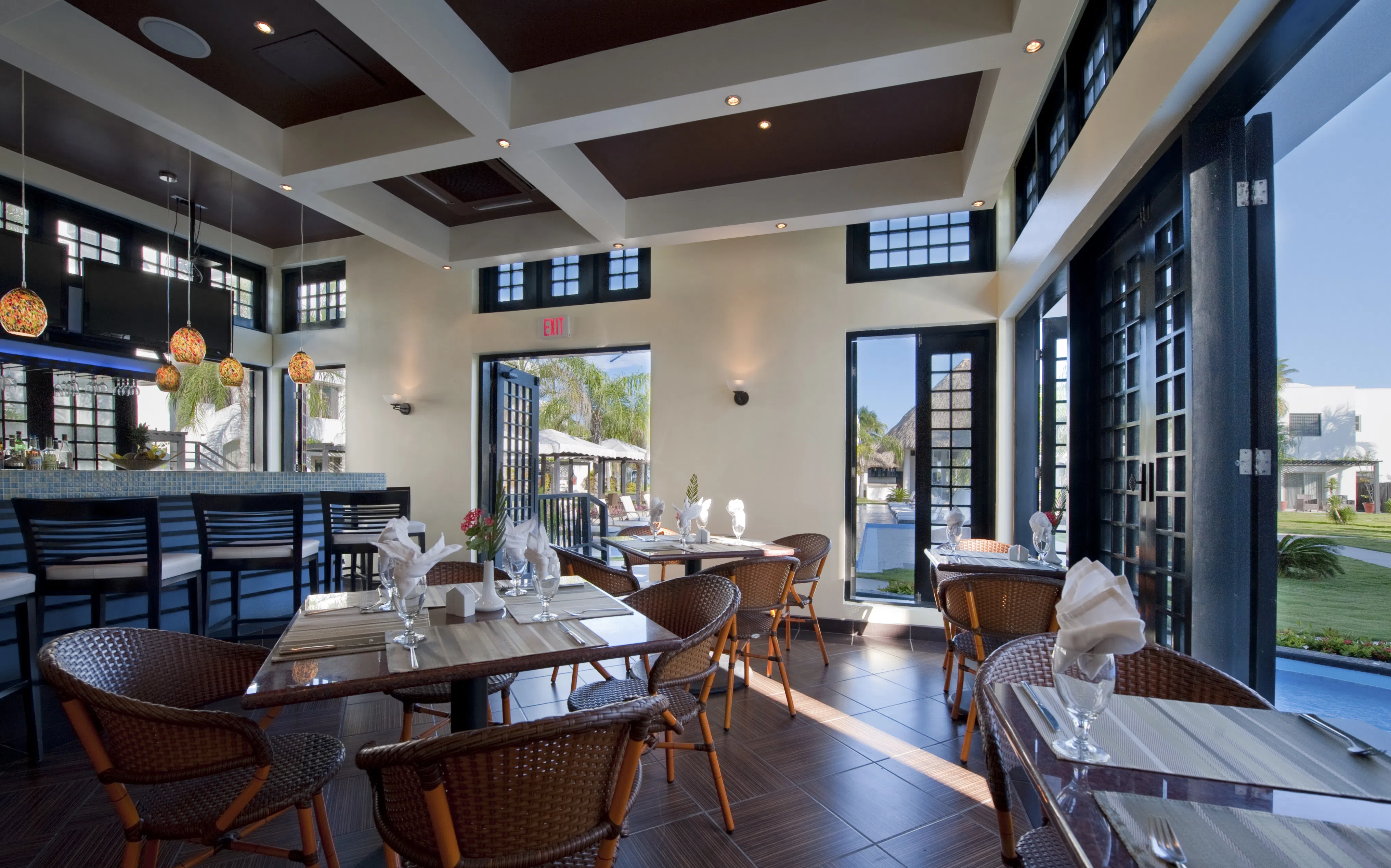 Romantic evening dining setting on the beach with ocean views and soft lighting