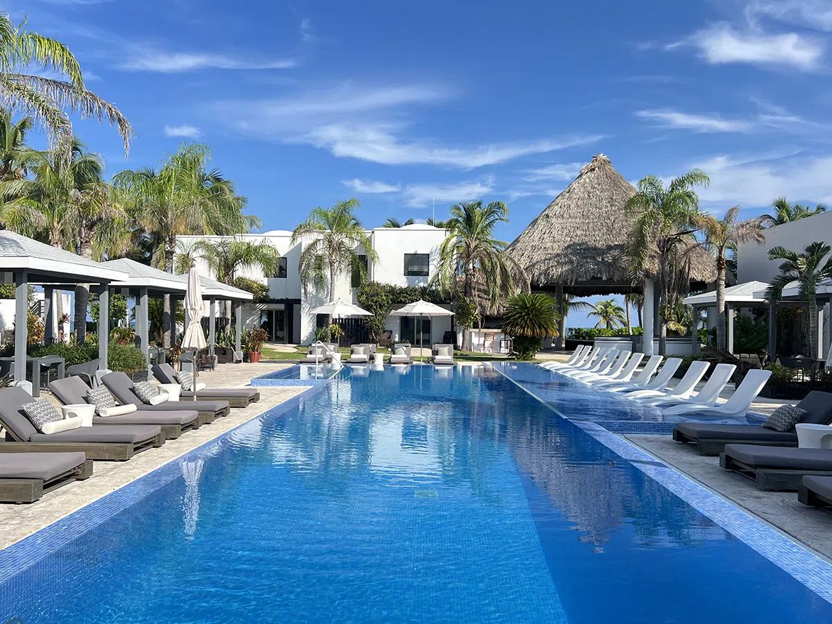 Beachfront dining at Las Terrazas with tables overlooking the water at golden hour